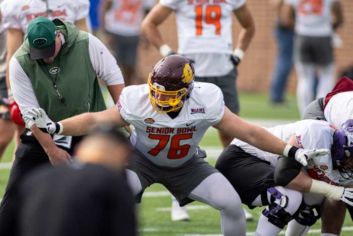 Feb 1, 2022; Mobile, AL, USA; National offensive lineman Bernhard Raimann of Central Michigan (76) works with a coach during National practice for the 2022 Senior Bowl at Hancock Whitney Stadium.